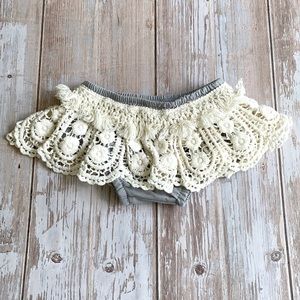 Gray and cream ruffled bloomers.